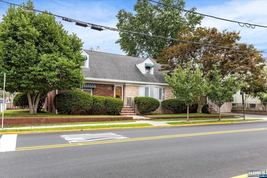 Welcome to this lovely expanded custom built 2 family home. This home is sure to please the most discerning buyer. Many upgrades including but not limited to new furnaces, new mini splits units on 1st fl. (see list of upgrades). There is an EIK w/center island & new SS appliances & additional bonus space that leads to sliding glass doors to your private patio with newly installed paver's & dedicated gas line for you BBQ. The banquet sized dining room is perfect to enjoy family meals while you gather in the spacious family room. Primary offers an en-suite half bath, plus 2 addt'l bedrooms w/generous closets. The basement is not to be missed with a wet bar, full bath, storage & laundry room. 2nd fl features 2 beds & 1 1/2 bath, living room open to the eat in kitchen with island and dining area, & two spacious bedrooms with ample closets & in unit washer & dryer. This home is perfectly located for ease of access to schools and all major highways and transportation.