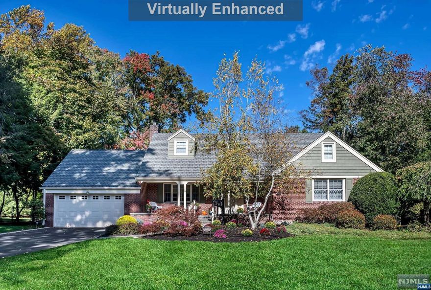 One Floor Living and Park-Like Property! Expanded and beautifully kept 3 bedroom, 2 1/2 bathroom Cape Colonial in the desirable Latchstring section of Oradell. Its many windows allow for tons of natural light & beautiful views. You will love the spacious living space with front to back of house living room and 20' x 20' family room with cathedral ceiling and Anderson windows. Renovated kitchen has pantry, breakfast nook and access to the dining room & deck area convenient for entertaining. First floor also boasts an updated powder room and primary suite with great closets and full bathroom. Upstairs you will find two large bedrooms and a newer full bathroom. Finished basement great for recreation & office space w/ laundry, utility room, storage & access to 2 car garage with amazing large walk-up storage loft. Backyard is serene, private and professionally landscaped - a true oasis. Generator & Hardwood Floors. Close to schools, NYC transportation, town, shops, parks & playgrounds.