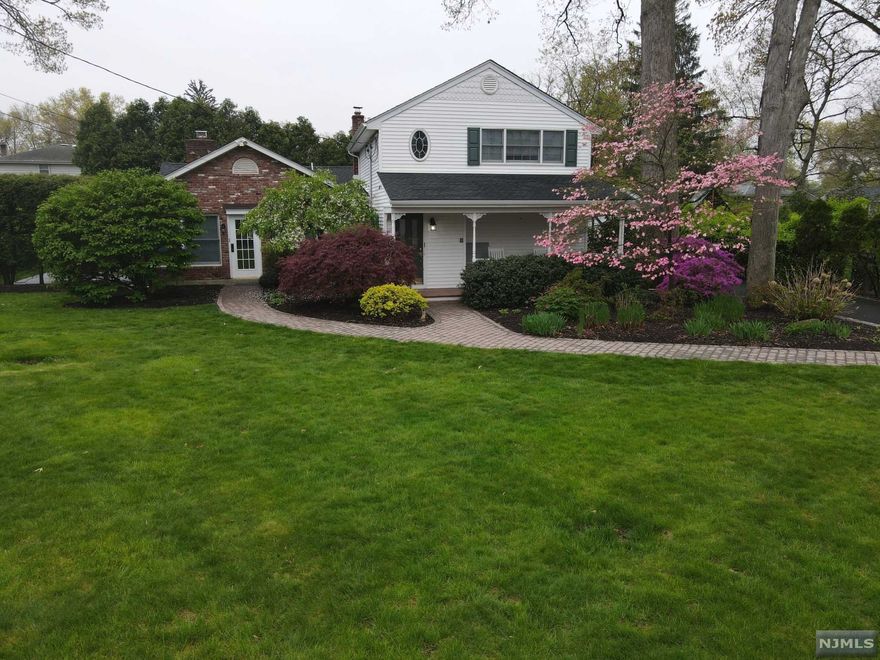 MANY recent updates make this home a must-see. The 3 BR,2 FB home w/giant front yard & private patio in the back is waiting for it's new owners to love it. The first floor boasts a NEW kitchen w/new appliances & lighting, w/ open-concept into the dining area surrounded by huge windows & natural light, and one side of an incredible double fireplace.The rest of the first floor boasts a dining room, LR with FP and vaulted ceilings, a door to the private patio, 2 BR, & a brand new FB & all newly finished hardwood floors. Off the first floor hallway is a big bonus room for den/office/etc., the laundry room, and storage/utility. The second floor consists of a large PrimarySuite, w/large Walk-In closets and a beautiful bathroom. This offers just the right amount of privacy and proximity to the first floor. There is a detached one car garage and a brand new roof.It is located very close to parks, schools, and retail. This home is updated and maintained for worry free living.