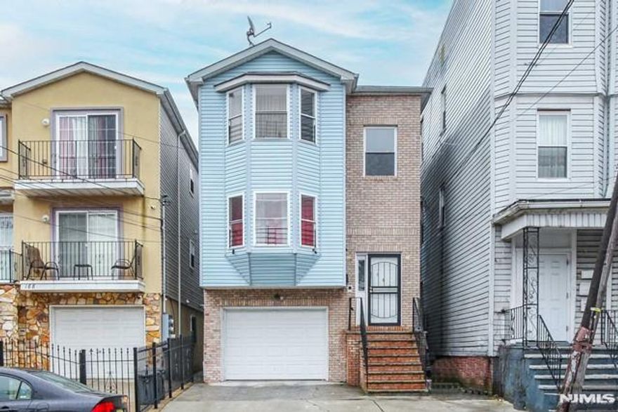 Welcome to 190 S 11th St, Newark! This spacious 2-Family home with a finished ground level and bonus rooms is perfect for investors or owner-occupants seeking rental income. Featuring a total of 6 bedrooms and 5 bathrooms, this property offers generous living space along with hardwood floors, central air, separate utilities, and a 1-car garage. Conveniently located near NYC transportation, Newark Penn Station, bus and train lines, major highways, universities, Downtown Newark, shopping, and schools, this property provides both comfort and accessibility. A great opportunity to own a versatile home in a prime Newark location!