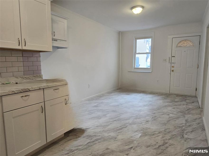 Updated ground floor apartment in Excellent Commuter Location very close to the Lyndhurst Train Station . This ground floor apartment offers new kitchen cabinets with granite counters, new floors, and has been freshly painted. Spacious bedroom, living room, and dining area. Center of town location. Parking space included. Heat and Hot Water included! Close to Lyndhurst Train Station, NYC buses, major highways. Great opportunity!