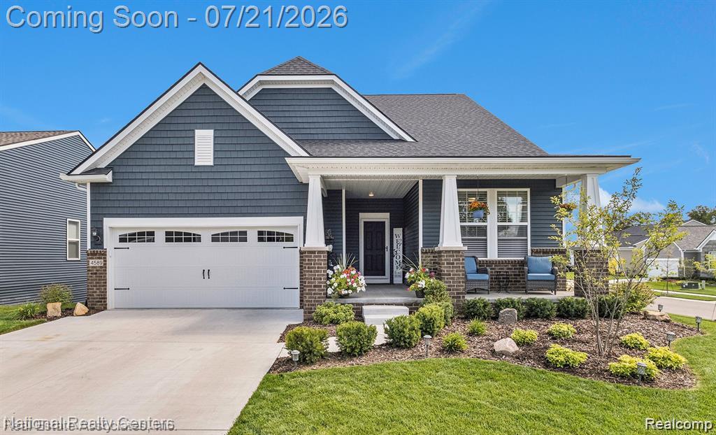 Contemporary exterior featuring dark blue horizontal siding and shake siding accents