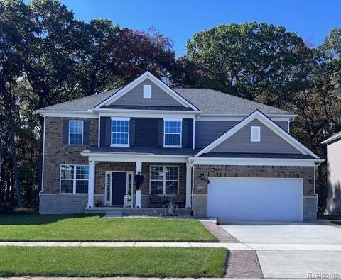 Photo of 51105 Deerbrook Drive, Macomb Township, MI 48042 (MLS # 20251053958)