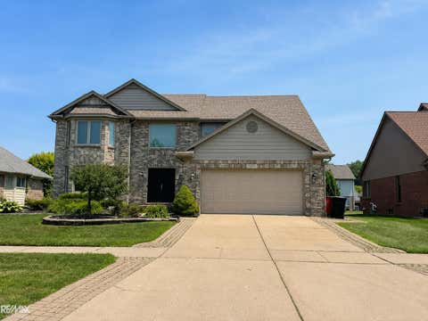 Photo of 46654 West Ridge Drive, Macomb Township, MI 48044 (MLS # 58050216079)