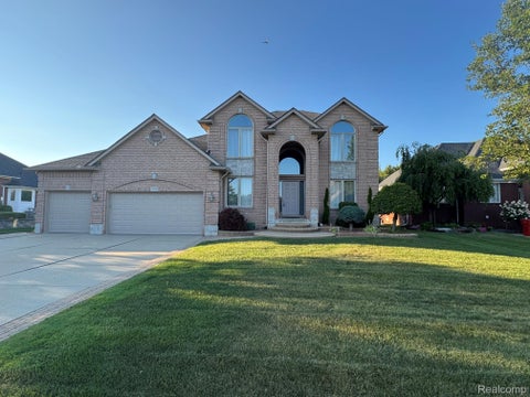 Photo of 17209 Invitational Drive, Macomb Township, MI 48042 (MLS # 20261059200)