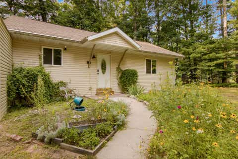 Photo of 880 Cedar Trail, Green Lake Township, MI 49643 (MLS # 78080072378)