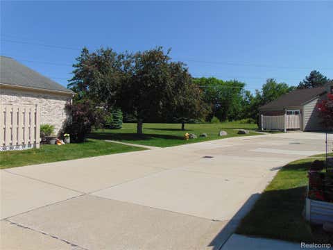 Tiny photo for 44167 Providence Drive #326, Clinton Charter Township, MI 48038 (MLS # 20261046683)