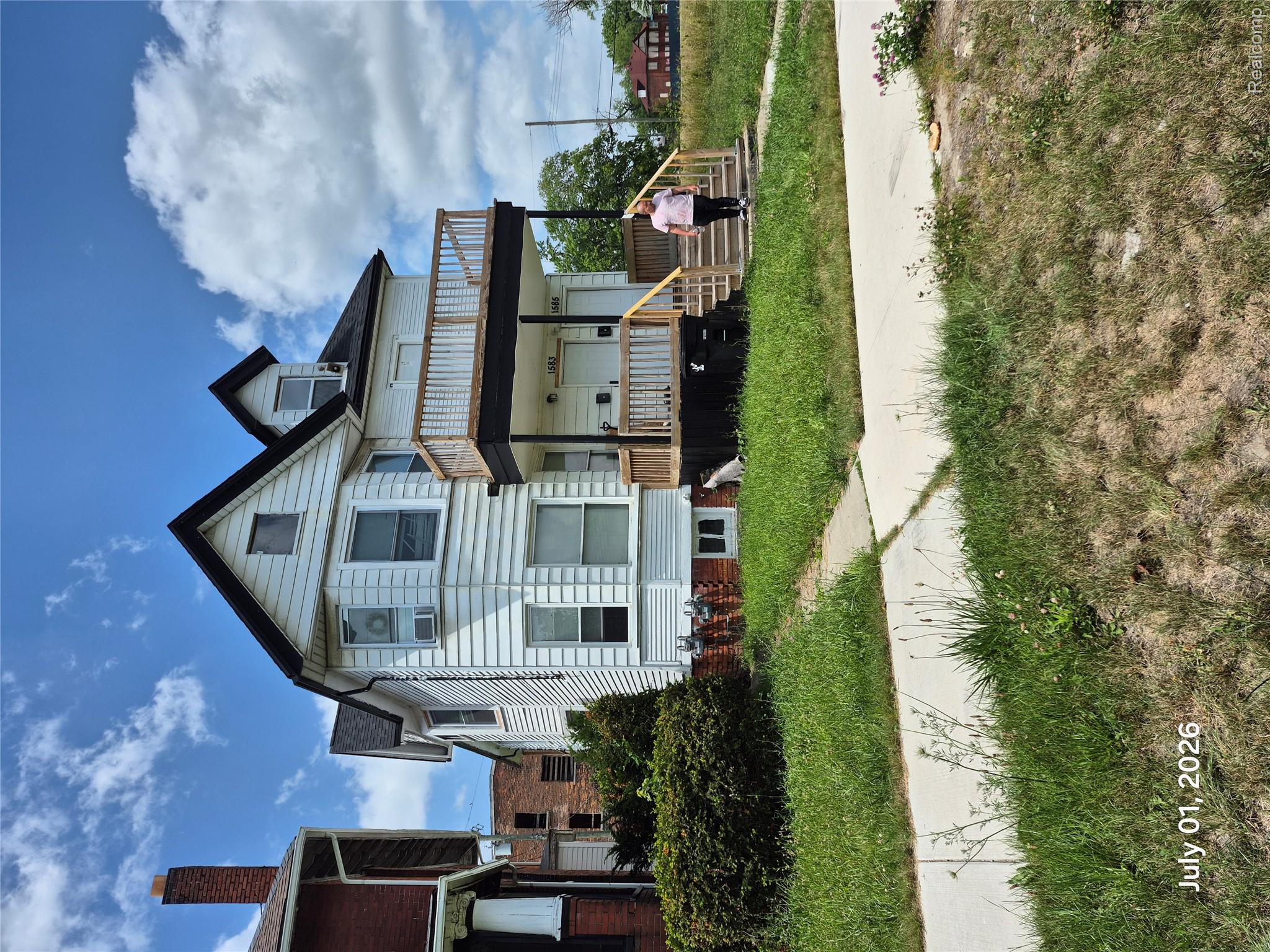 Tremendous area of higher end homes walking distance to jefferson and the riverfront .Two-story white siding residence featuring a prominent front porch with wooden railings and stairs