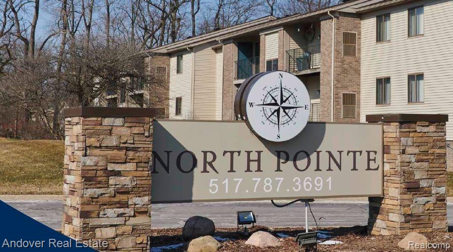 Stone veneer monument sign with integrated compass rose detail