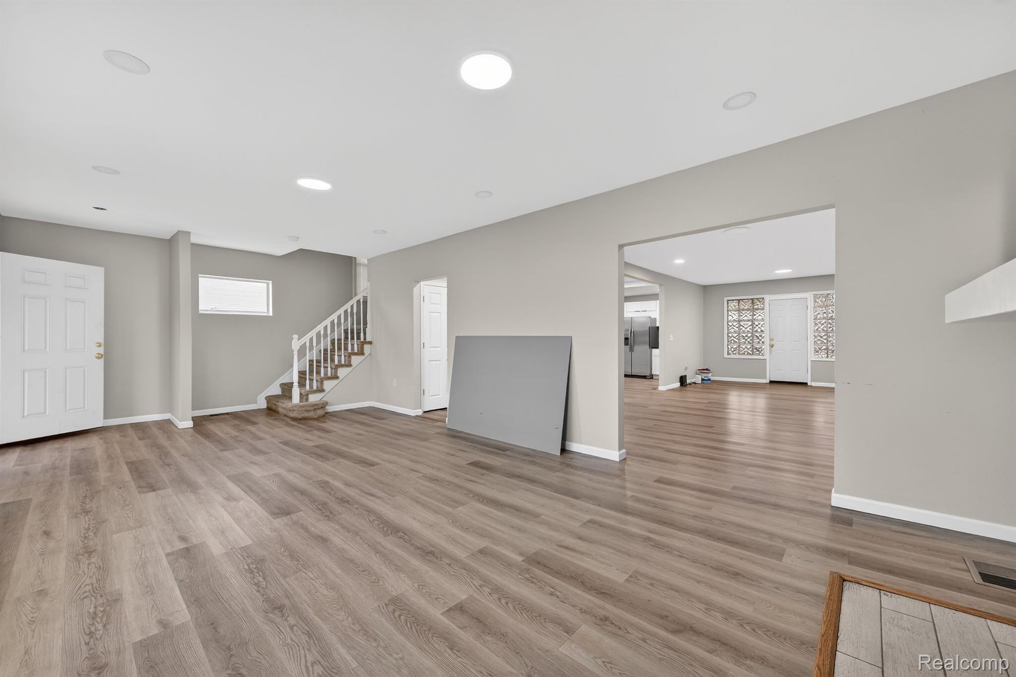 Unfurnished living room with light wood-style floors and recessed lighting