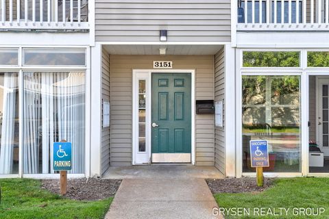 Photo of 3151 Poplar Creek Drive SE #304, Kentwood City, MI 49512 (MLS # 65025051236)