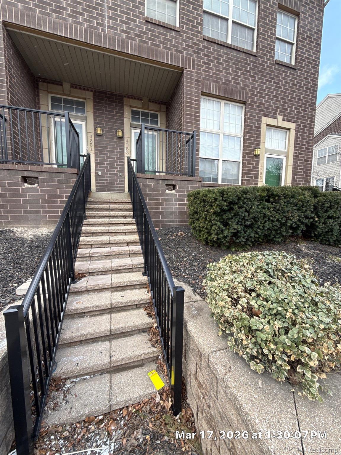 Brick facade building featuring multiple entryways