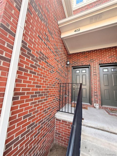 Photo of 403 Legato Drive #403, Walled Lake City, MI 48390 (MLS # 20261018158)