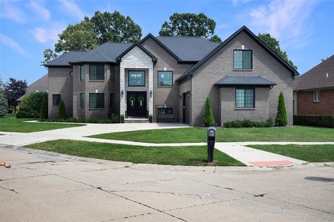 Photo of 46930 Riverpark Dr E, Macomb Township, MI 48044 (MLS # 20251026631)
