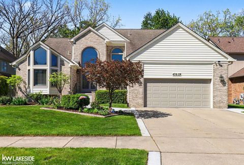 Photo of 47619 Lamplighter Trail, Macomb Township, MI 48044 (MLS # 58050207886)