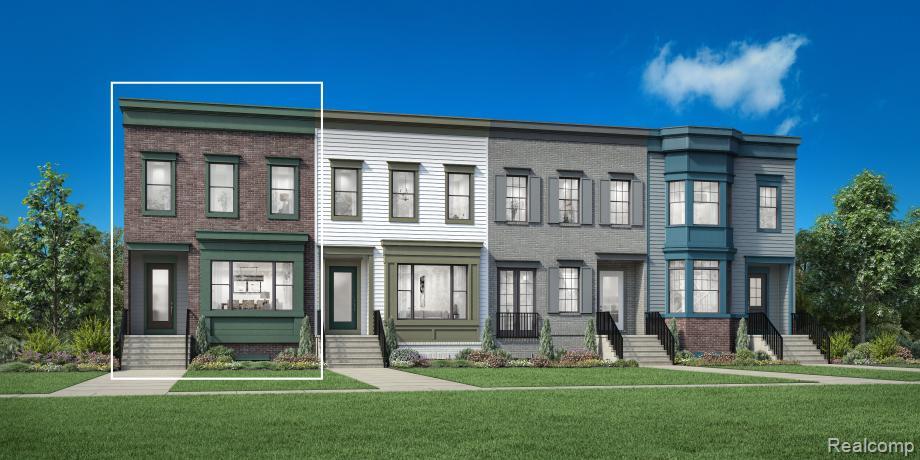 Classic brick facade townhome featuring a projecting bay window, dark green trim accents, and a covered entry