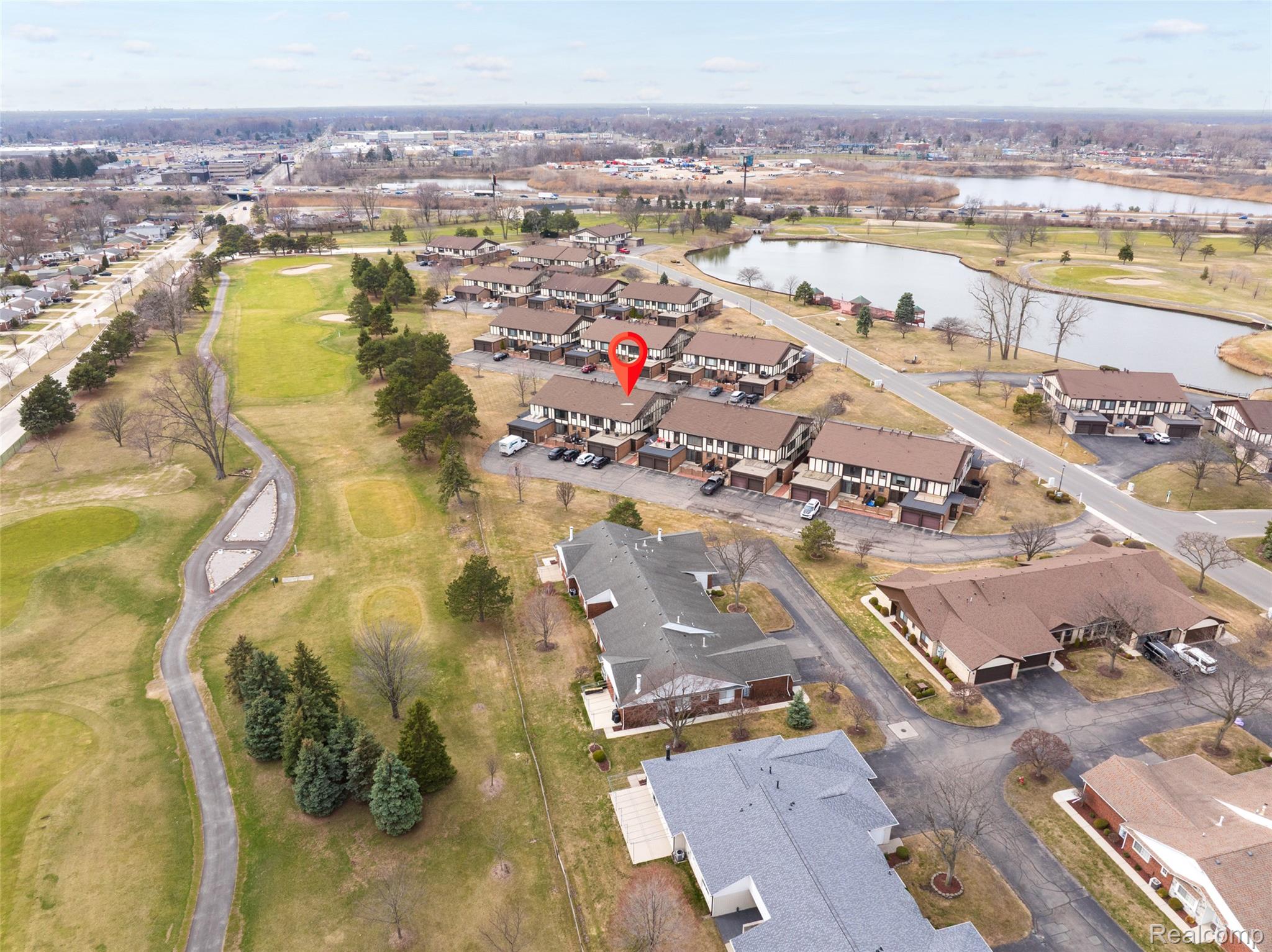 Aerial view of property's location with nearby suburban area