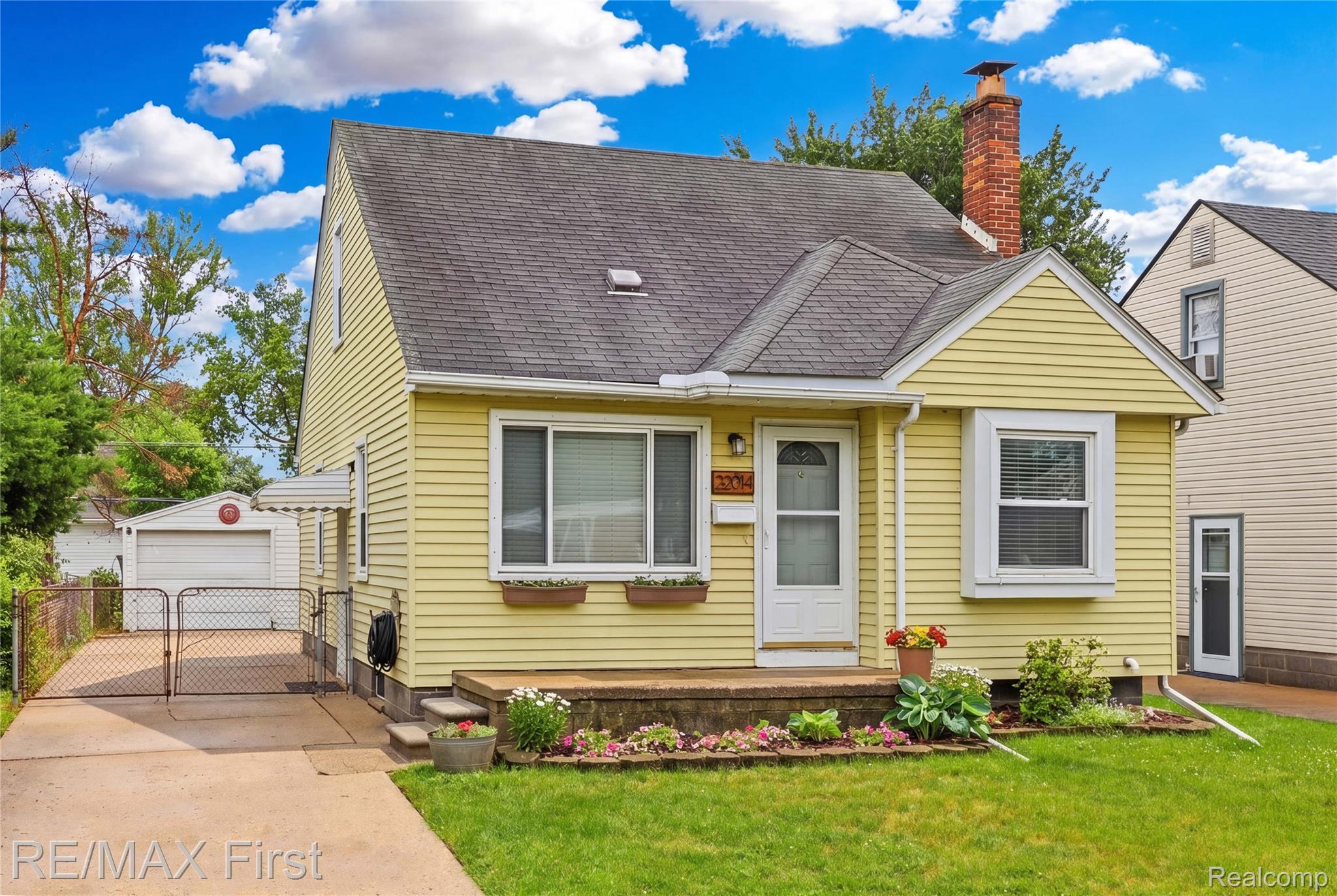 Yellow siding exterior with white trim