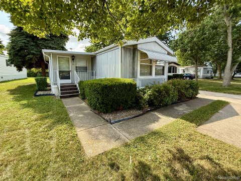 Photo of 39 Oakridge RDG E, Monroe Charter Township, MI 48161 (MLS # 20261057005)