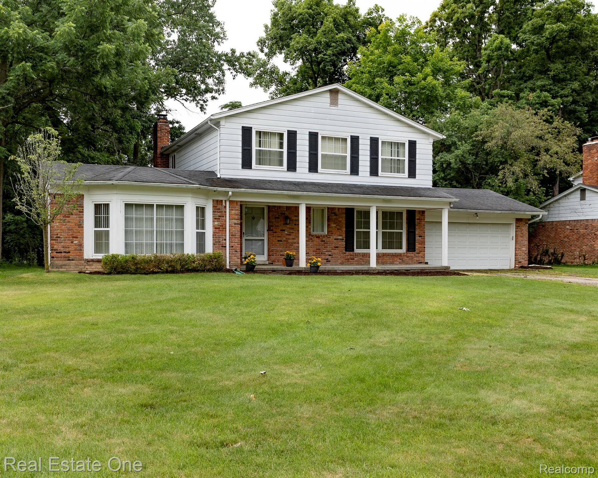 Traditional architectural style with brick and siding facade