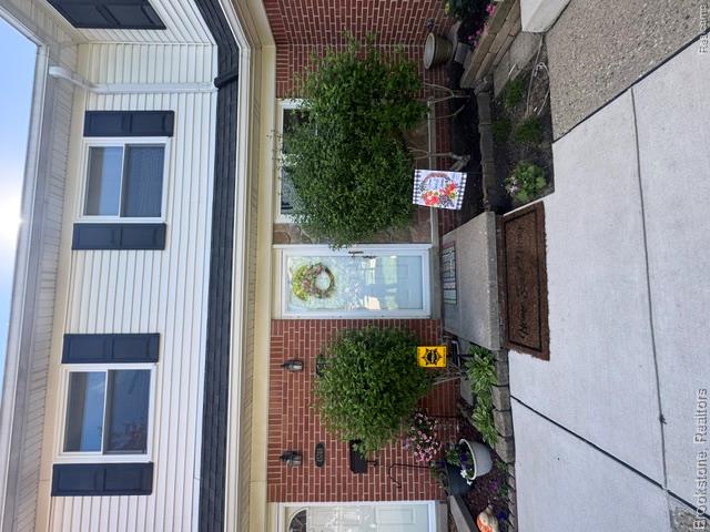Vinyl siding exterior with brick and stone accents