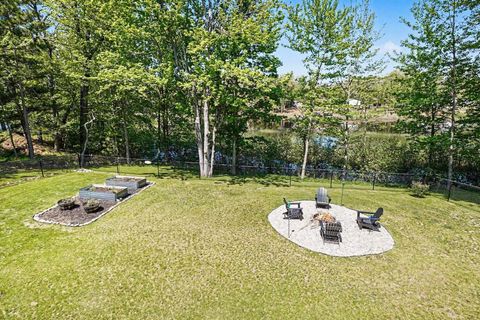 Tiny photo for 1735 Iroquois Trail, Grant Township, MI 48748 (MLS # 77080068998)