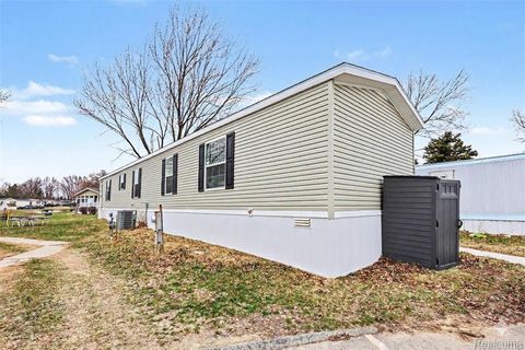 Photo of 49611 Au Lac Dr E, Macomb Township, MI 48051 (MLS # 20261018017)