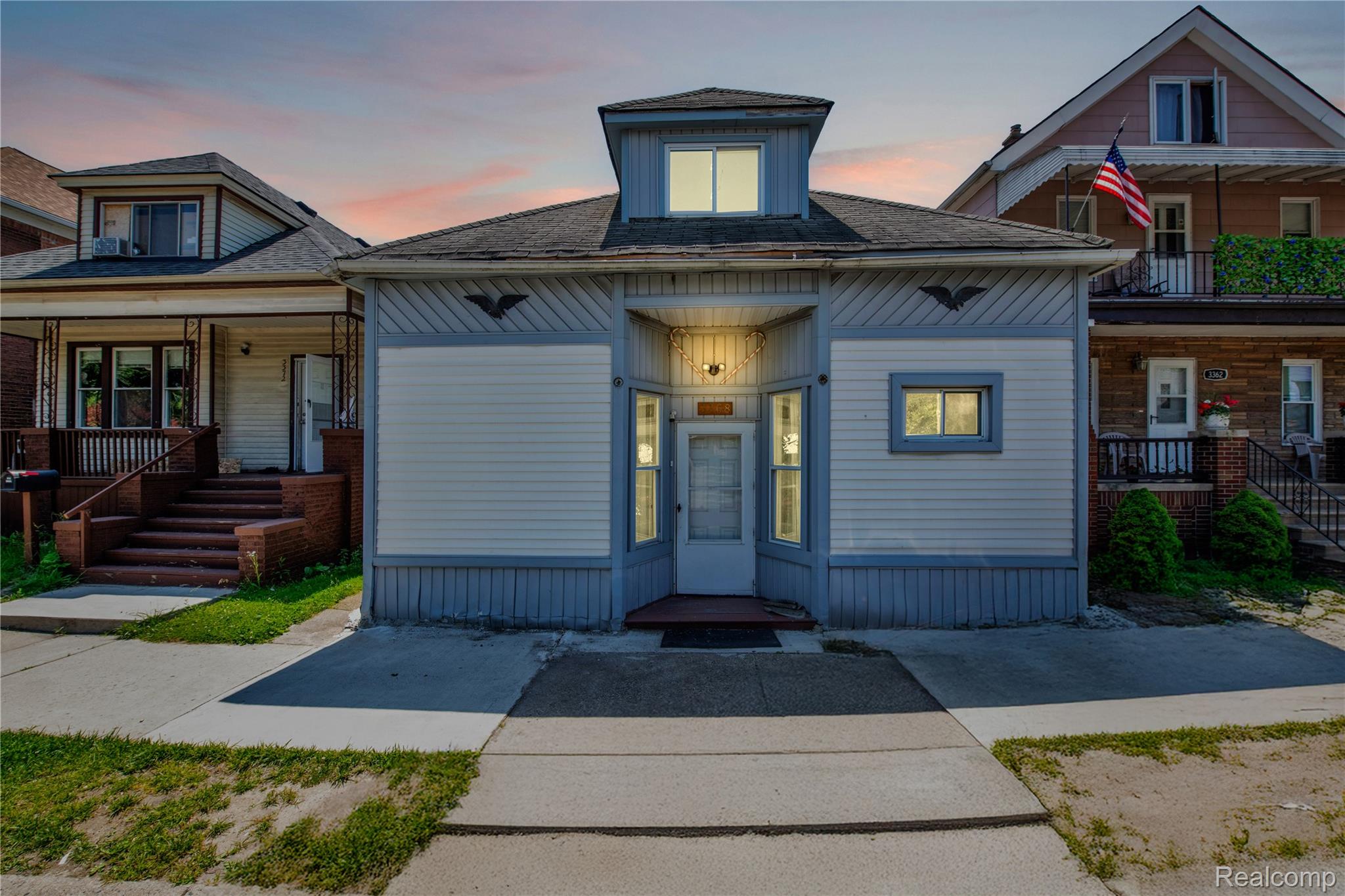 Bungalow-style house with a porch and a shingled roof