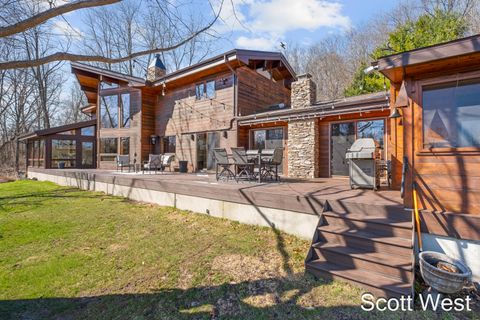 Photo of 2870 Grand River Drive NE, Ada Township, MI 49525 (MLS # 65026010075)