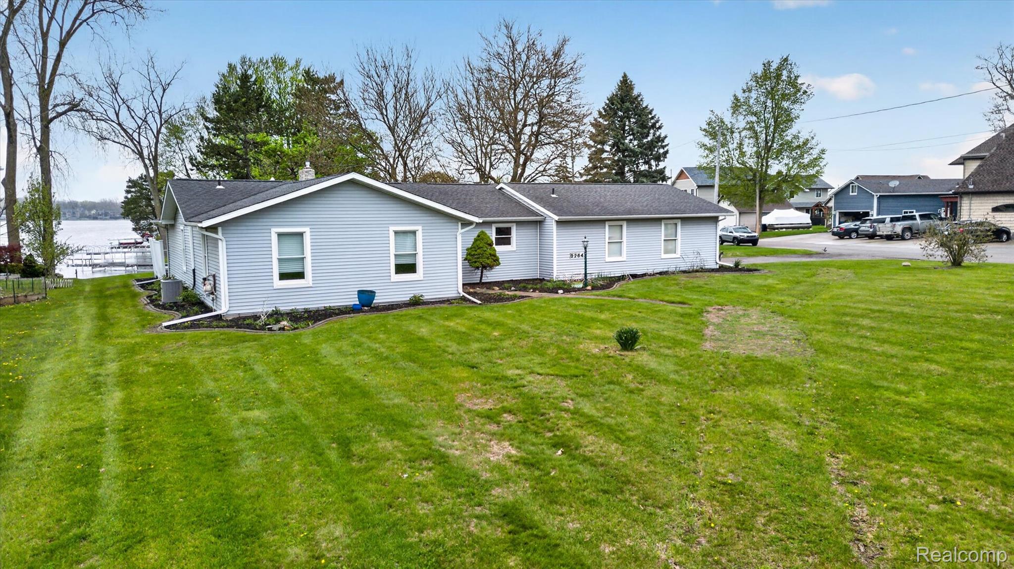 Rear view of house with a yard