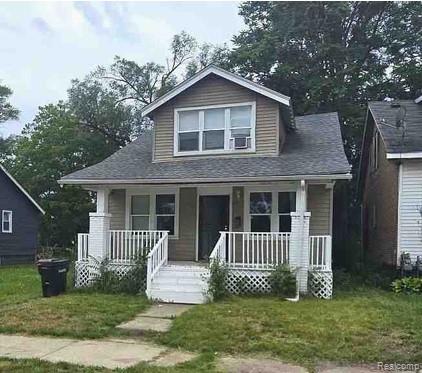 Two-story residential property featuring a dormer window