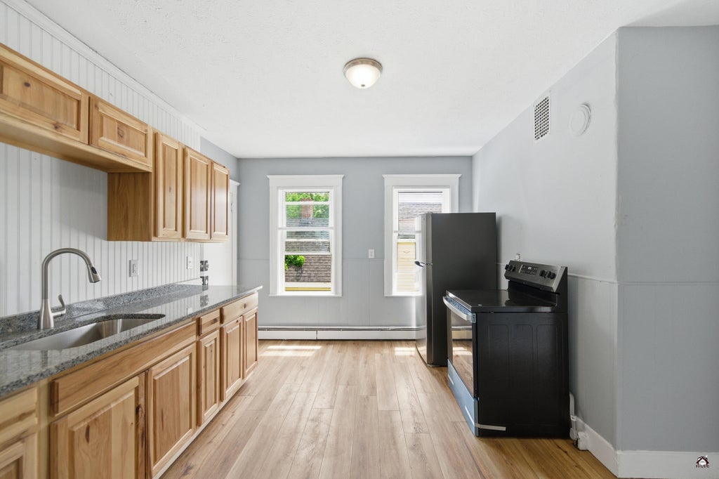 Photo of 166 Bartlett Street, Lewiston, ME 04240 (MLS # 1665094)