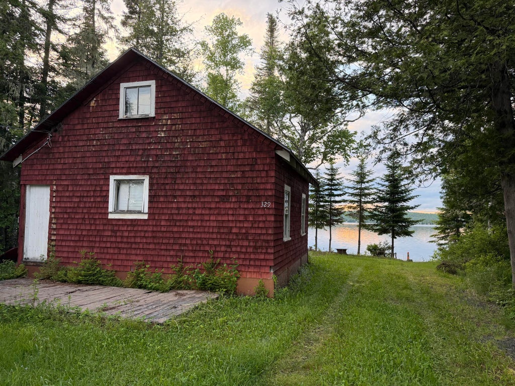 Photo of 329 South Shore Road, Madawaska Lake Twp, ME 04783 (MLS # 1668773)