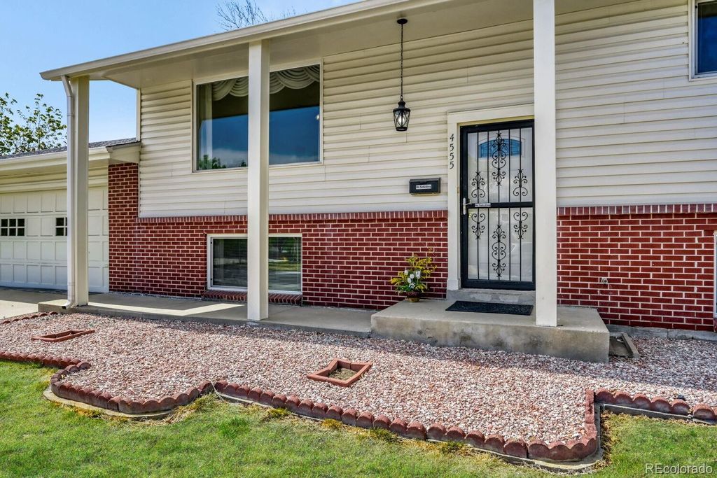 Photo of 4555 W 65th Avenue, Arvada, CO 80003 (MLS # 4122373)