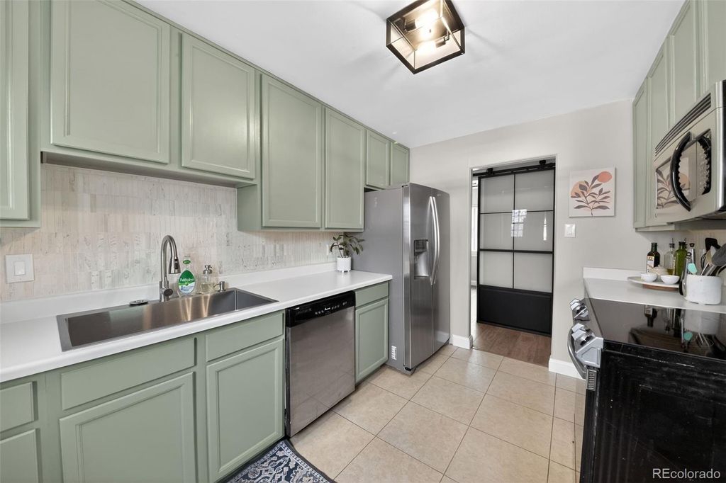 Photo of 9095 W Mississippi Avenue, Lakewood, CO 80226 (MLS # 7729835)