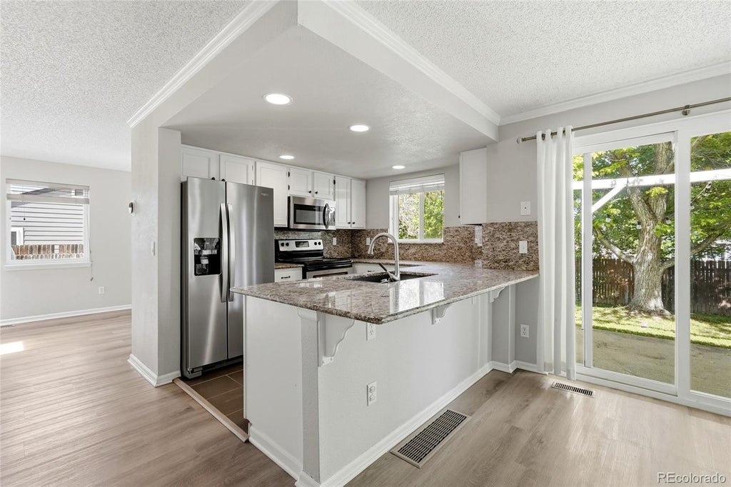 Photo of 4924 S Dunkirk Way, Centennial, CO 80015 (MLS # 9534926)
