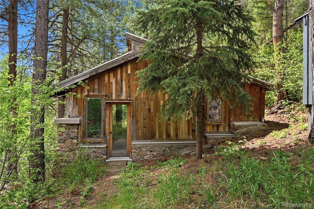 Photo of 9717 S Deer Creek Canyon Road, Littleton, CO 80127 (MLS # 6939644)