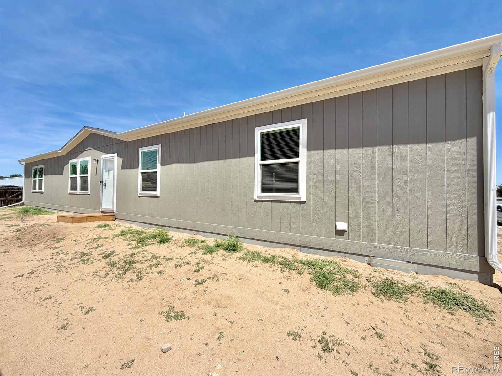 Photo 1 of 27 — 103 Beach Drive, Log Lane Village, CO 80705