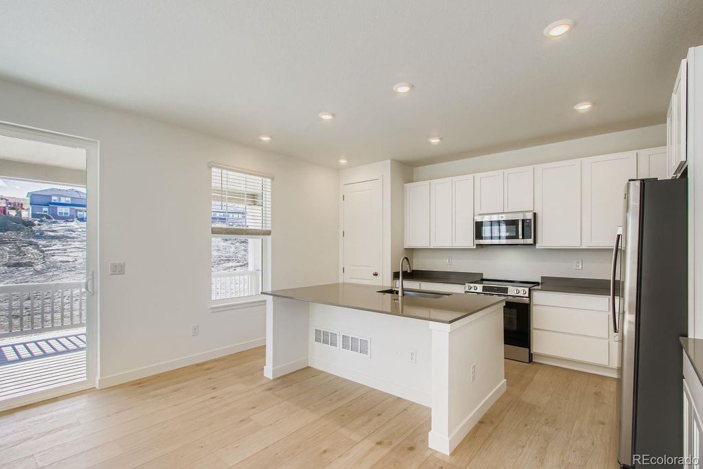 Photo of 12680 W Glasgow Place, Littleton, CO 80127 (MLS # 7952454)