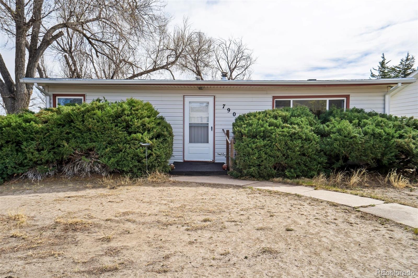 View from J Avenue highlighting the front of the home.