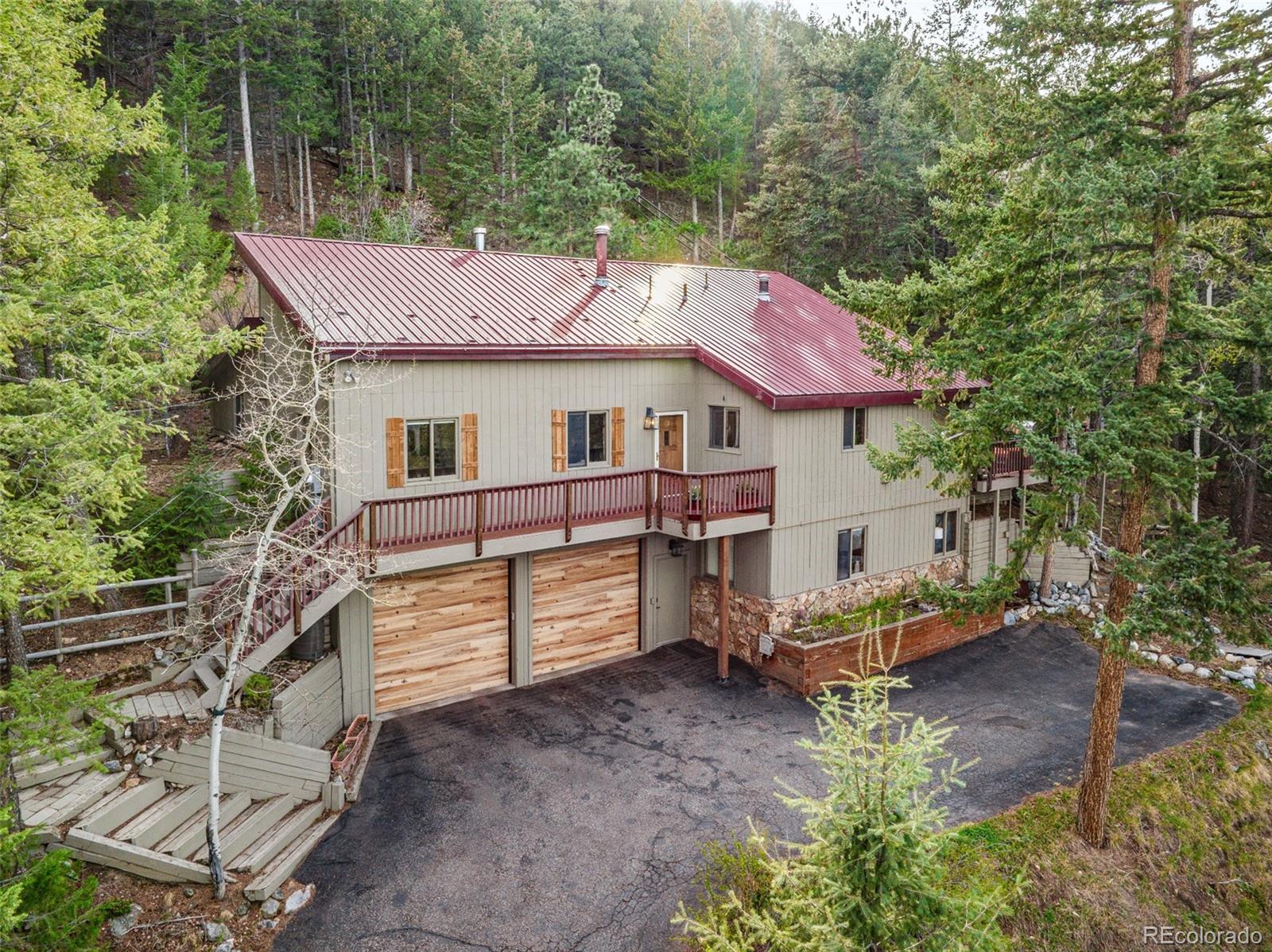 A peaceful foothills retreat just minutes from Evergreen?s best amenities.