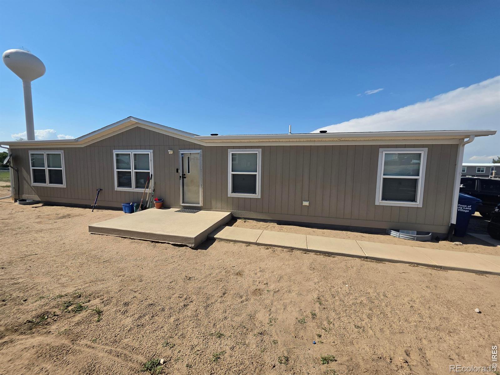 Photo 1 of 12 — 209 Larch Drive, Log Lane Village, CO 80705
