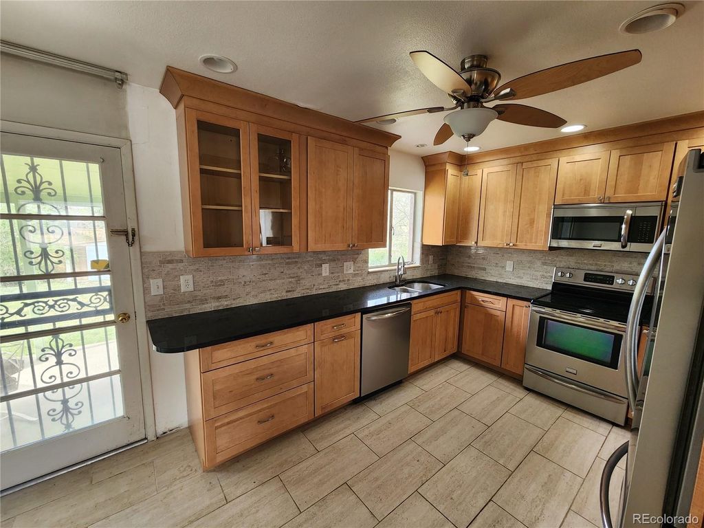 Photo of 6525 E Harvard Avenue, Denver, CO 80224 (MLS # 3059954)