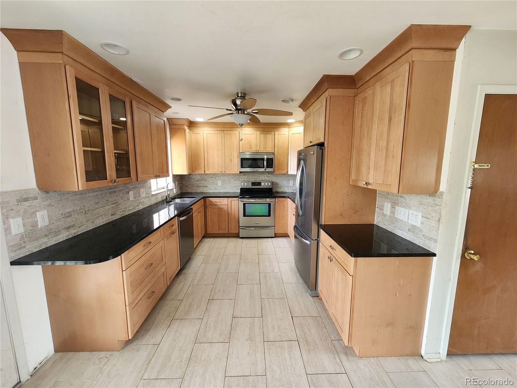 Photo of 6525 E Harvard Avenue, Denver, CO 80224 (MLS # 3059954)