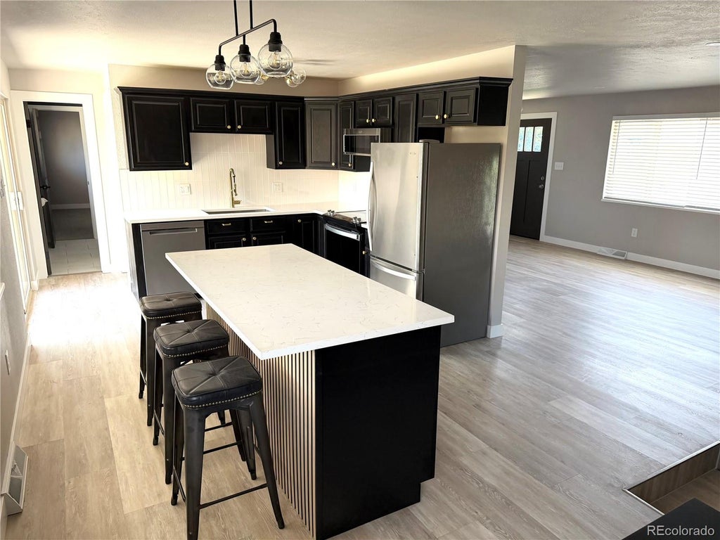 Photo of 9457 W Arizona Avenue, Lakewood, CO 80232 (MLS # 3640994)