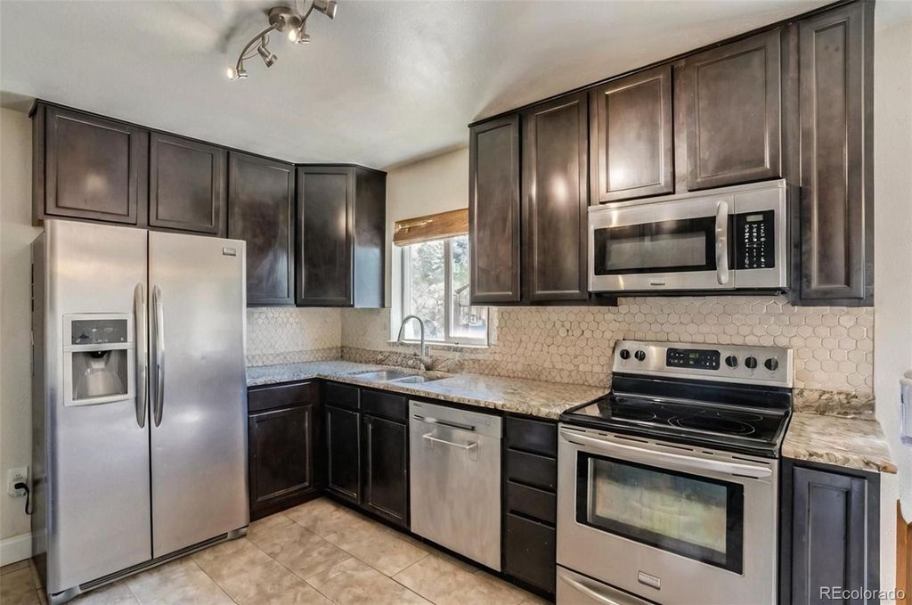 Photo of 10250 W 65th Avenue, Arvada, CO 80004 (MLS # 4666891)