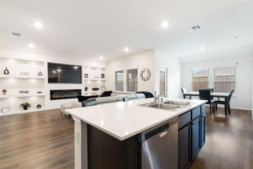 WELCOME HOME TO This STYLISH MODERN CONTEMPORARY FEEL OPEN CONCEPT HOME! Nestled in the highly sought-after TRAILWIND COMMUNITY, this beautifully maintained home perfectly blends thoughtful design with modern elegance. EVERY DETAIL HAS BEEN CAREFULLY CURATED TO OFFER BOTH FUNCTION AND FLAIR, CREATING A WARM, INVITING ATMOSPHERE THAT FEELS LIKE HOME THE MOMENT YOU WALK IN. Step inside to discover a BRIGHT, OPEN-CONCEPT FLOOR PLAN WHERE THE LIVING ROOM, DINING AREA, AND KITCHEN FLOW SEAMLESSLY TOGETHER—IDEAL FOR EVERYDAY LIVING AND EFFORTLESS ENTERTAINING. A MODERN ELECTRIC FIREPLACE with sleek shelving, built in LED lights and a TV feature wall sets the tone for cozy gatherings and contemporary charm. The CHEF-INSPIRED KITCHEN boasts granite countertops, stainless steel appliances, and abundant cabinetry to keep everything STYLISHLY ORGANIZED. Retreat to the spacious master suite, complete with a walk-in closet and a private en-suite bath for your own SERENE ESCAPE. Secondary bedrooms provide comfort and flexibility, perfect for family, guests, or a home office. OUTSIDE, ENJOY AN OVERSIZED BACKYARD WITH A COVERED PATIO, OFFERING THE PERFECT SPACE FOR RELAXING EVENINGS OR WEEKEND BARBECUES. With true pride of ownership evident throughout, this home is move-in ready and waiting for its next chapter. CONVENIENTLY LOCATED NEAR SHOPPING, DINING, AND MAJOR COMMUTER ROUTES, YOU’LL LOVE THE EASY ACCESS TO MESQUITE, DALLAS, AND BEYOND. IMPECCABLE. INVITING. INSPIRED. THIS TRAILWIND TREASURE IS EVERYTHING YOU’VE BEEN LOOKING FOR!!! SCHEDULE YOUR SHOWING TODAY!