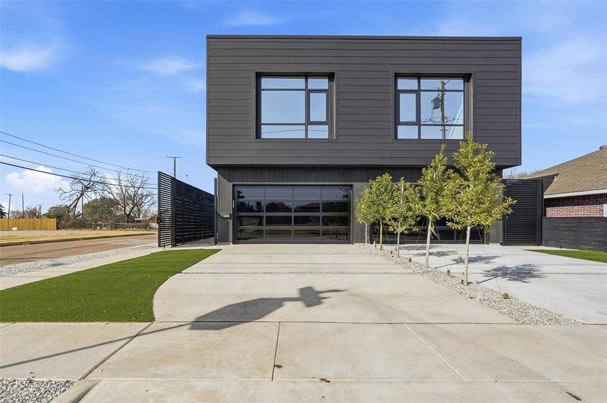 Welcome to one of Inwood Park’s most stylish modern duplexes, where clean design meets everyday comfort. The exterior makes a bold first impression with sleek black slat walls and smooth Hardie panels, creating a look that feels contemporary yet timeless. A metal gate and stained fence provide both privacy and a sense of security as you arrive. Inside, the main living space flows effortlessly to the backyard through large sliding glass doors, filling the home with natural light and making indoor-outdoor living easy. The interior features smooth walls, oversized windows, a striking metal staircase, and concrete floors with a terrazzo-inspired finish. The kitchen is both functional and beautiful, with white oak cabinetry, Bosch appliances, and a quartz island with waterfall edges—perfect for casual meals or entertaining. Upstairs, Porcelanosa wood floors lead you to the spacious primary suite, complete with an impressive bathroom and generous closet. A flexible bonus room with floor-to-ceiling glass dividers works perfectly as a home office, gym, or creative space. The front bedroom offers a comfortable retreat for guests, while the low-maintenance backyard with turf provides a great spot to relax without the upkeep. Ideally located just minutes from Inwood Park Village, Highland Park Village, Knox-Henderson, and Love Field, this home offers modern living in a truly convenient location. A perfect blend of style, function, and lifestyle.
