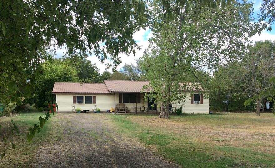 This 1,488 sf house on 1.2 acres has 3 bedrooms 2 baths and tons of potential!  The spacious and treed back yard has a workshop with electricity, storage building and a shed.  With some TLC and effort this property could truly shine!  Located between Lake Bois D Arc and Lake Ralph Hall outdoor entertainment is just a short drive away.