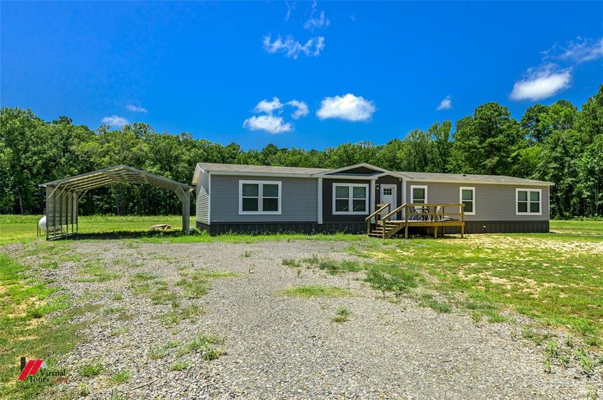 If you are looking for a beautiful, as good as brand new, farmhouse style manufactured home with acreage and absolutely nothing needed to move in, this could be the one!  This 2024 home has been meticulously cared for and barely lived in.  Along with the FOUR bedrooms and THREE full bathrooms, there have been numerous upgrades done including stainless appliances, smart hot water heater, larger than recommended HVAC unit and propane fireplace.  Along with the nice amenities inside, a whole home propane generator, front deck, double carport, and HUGE screened in back porch have been added.  Schedule your showing before this one is gone.
